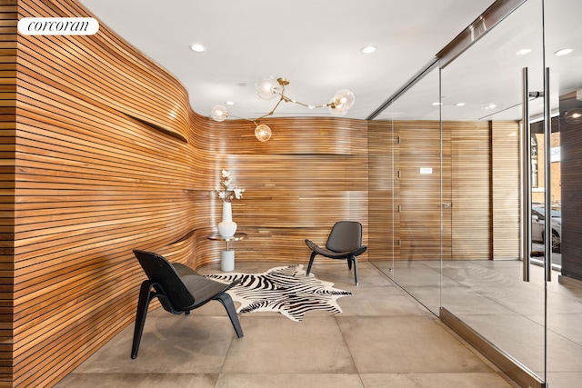 236 17th St Unit 6C, New York City, NY 11215 - living area featuring wood walls and recessed lighting