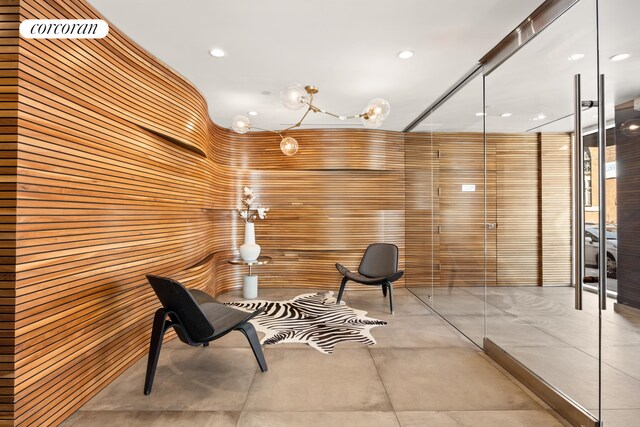 236 17th St Unit 6C, New York City, NY 11215 - living area featuring wood walls and recessed lighting