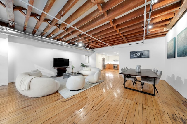 554 Broome St Unit 4Thfloor, New York City, NY 10013 - living room with hardwood / wood-style flooring and baseboards