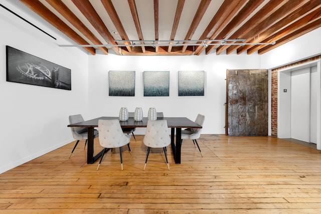 554 Broome St Unit 4Thfloor, New York City, NY 10013 - dining space featuring elevator and wood-type flooring