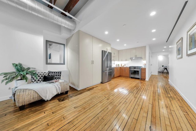 554 Broome St Unit 4Thfloor, New York City, NY 10013 - living area featuring light wood-style floors, baseboards, and recessed lighting