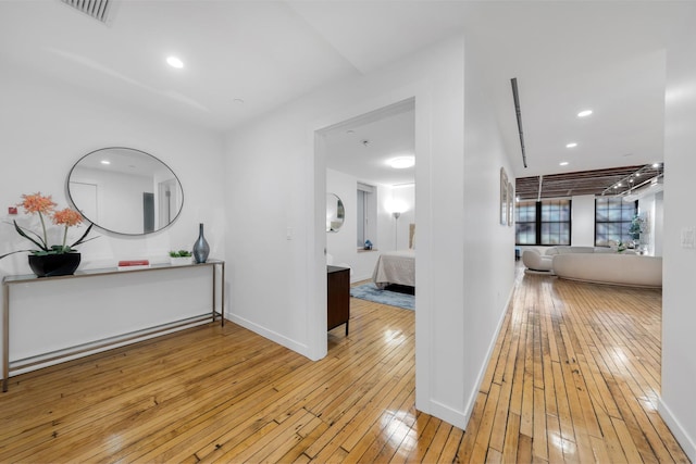 554 Broome St Unit 4Thfloor, New York City, NY 10013 - hall featuring light wood-type flooring, baseboards, and recessed lighting