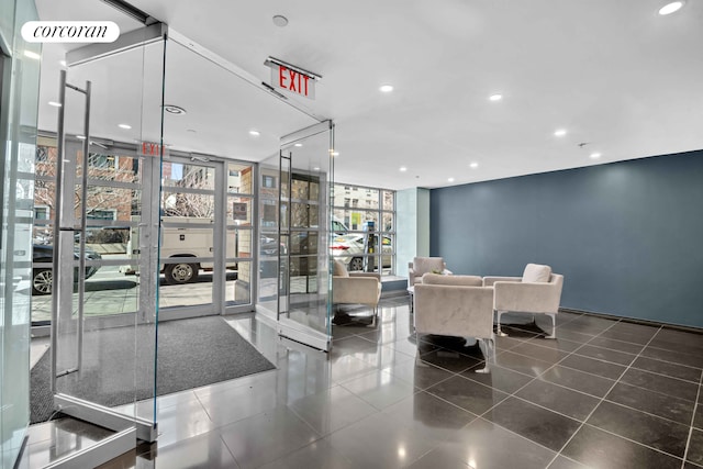 common area with expansive windows and recessed lighting