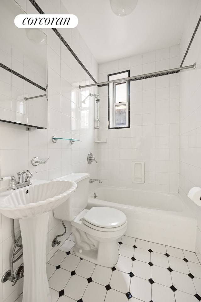 full bathroom featuring  shower combination, tile walls, and toilet