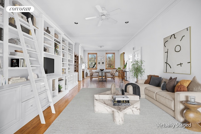 living room featuring crown molding, ceiling fan, recessed lighting, and wood finished floors