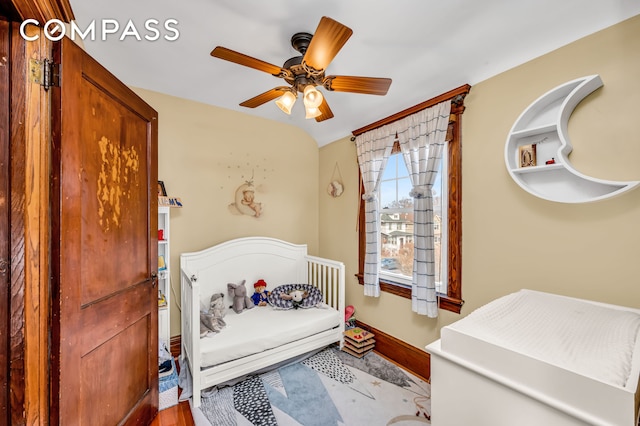 bedroom with baseboards and a ceiling fan
