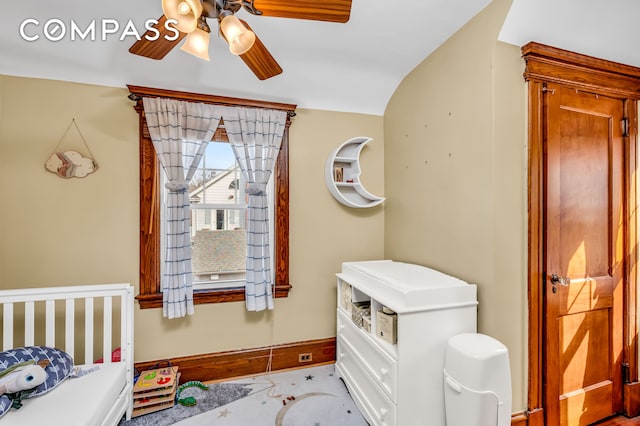 bedroom with baseboards and a ceiling fan