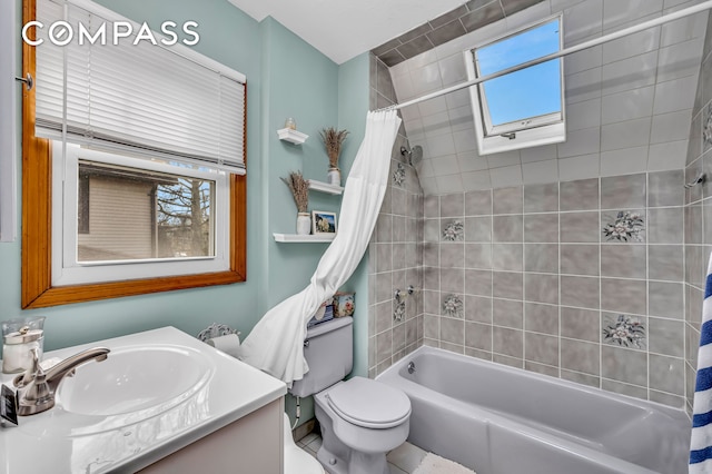 full bath with vanity, shower / bath combo, and toilet