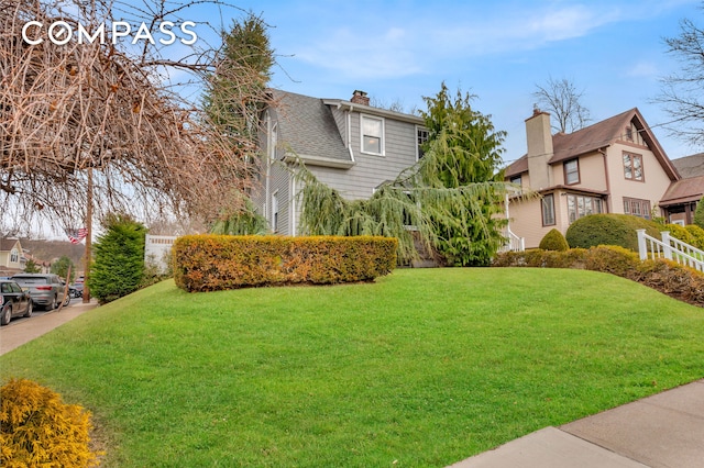 view of yard with fence and a residential view
