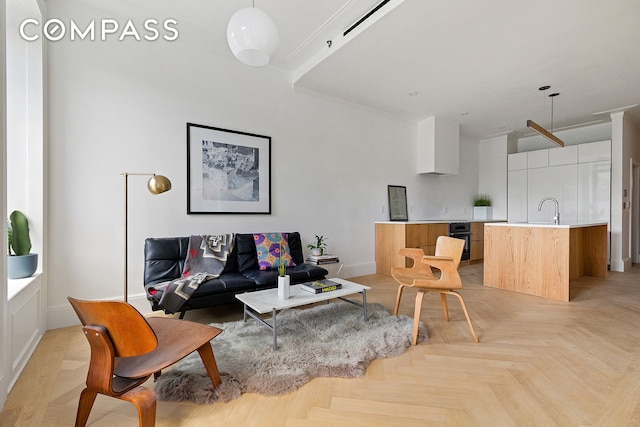 129 Malcolm X Blvd Unit 3, New York City, NY 11221 - living room featuring ornamental molding and baseboards