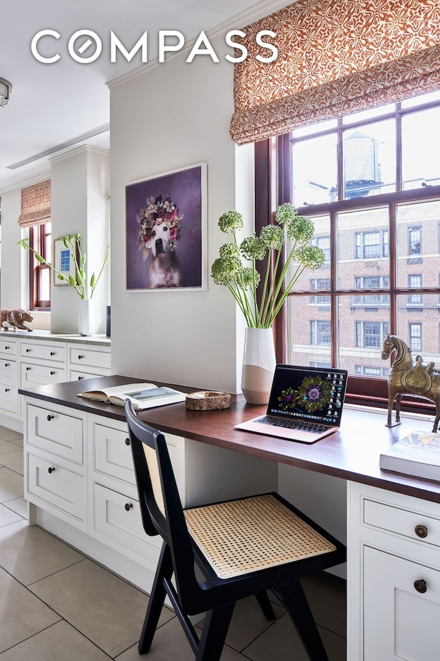 823 Park Ave Ph, Ph, New York City, NY 10021 - home office featuring light tile patterned floors, healthy amount of natural light, and ornamental molding