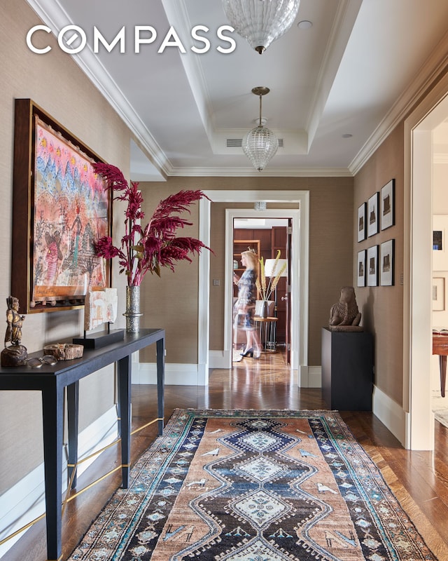 823 Park Ave Ph, Ph, New York City, NY 10021 - hall featuring a tray ceiling, wood finished floors, crown molding, and baseboards