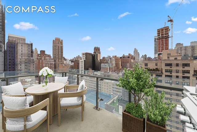 255 E 74th St Unit 14C, New York City, NY 10021 - balcony featuring a view of skyline