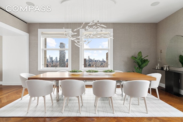 2 Park Pl Unit 35A, New York City, NY 10007 - dining room featuring a chandelier, a view of skyline, wood finished floors, and wallpapered walls