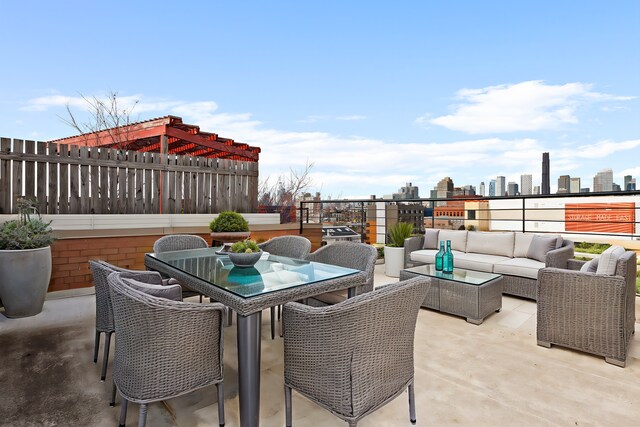 view of patio / terrace with an outdoor hangout area, outdoor dining space, and a skyline view