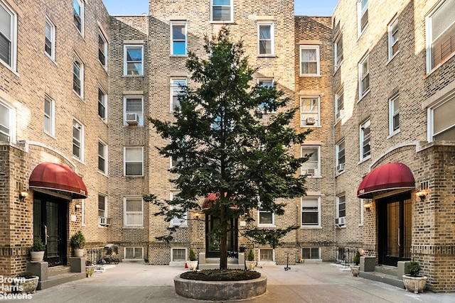 view of apartment building / complex featuring cooling unit