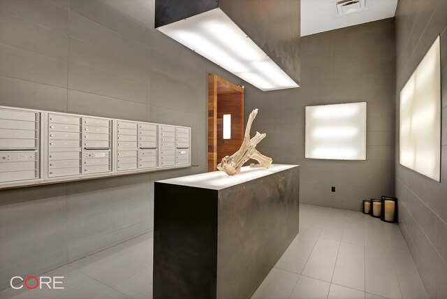 305 W 16th St Unit 4E, New York City, NY 10011 - view of community with tile walls and mail area