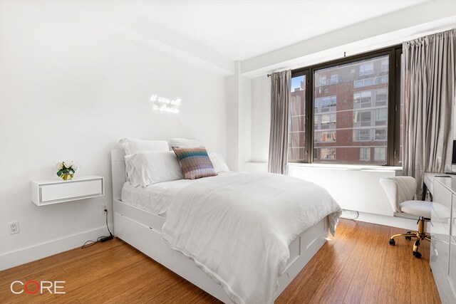 305 W 16th St Unit 4E, New York City, NY 10011 - bedroom featuring wood finished floors