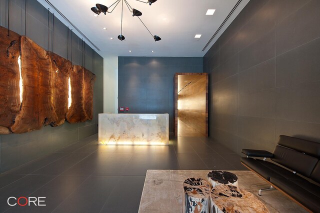 305 W 16th St Unit 4E, New York City, NY 10011 - interior space with tile walls and dark tile patterned floors