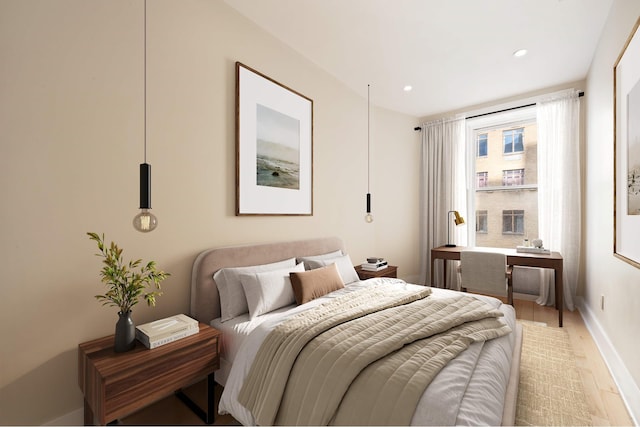 bedroom with light wood-style floors, recessed lighting, and baseboards