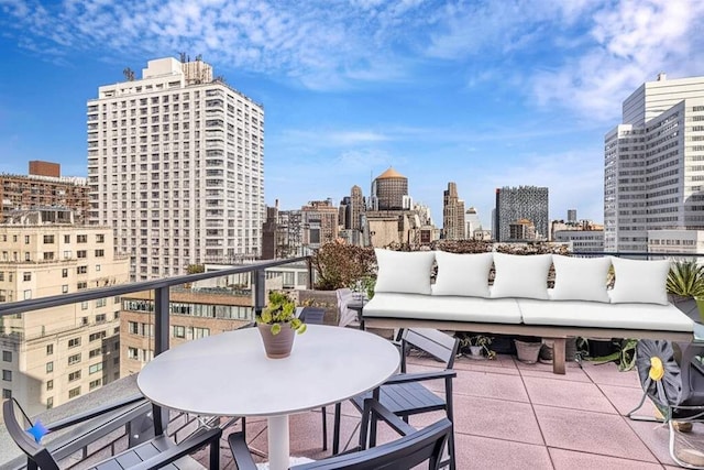 169 E 69th St Unit 19A, New York City, NY 10021 - view of patio / terrace with a view of skyline, an outdoor hangout area, and a balcony