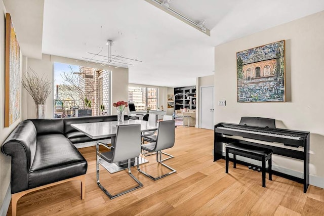 169 E 69th St Unit 19A, New York City, NY 10021 - dining space featuring light wood finished floors