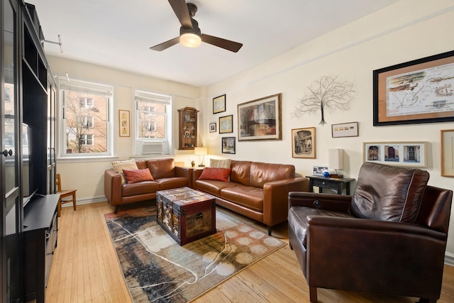 86-10 34th Ave Unit 113, New York City, NY 11372 - living room featuring a ceiling fan, light wood-style flooring, and baseboards