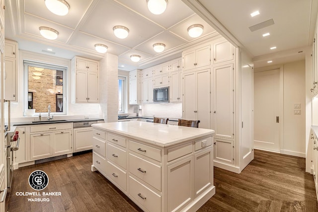 kitchen featuring black microwave, a sink, coffered ceiling, dark wood finished floors, and dishwasher