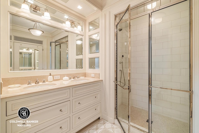 bathroom with crown molding, a stall shower, and double vanity