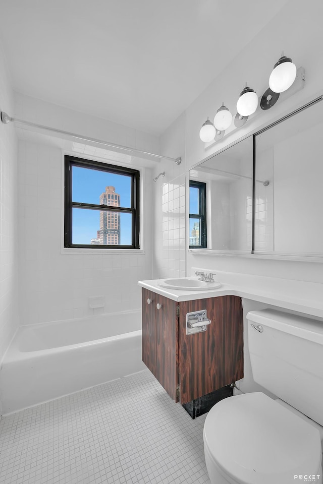 345 E 80th St Unit 28-C, New York City, NY 10075 - full bath featuring toilet, shower / washtub combination, vanity, and tile patterned flooring