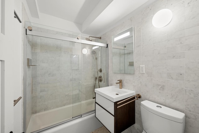 235 E 57th St Unit 8F, New York City, NY 10022 - full bathroom with toilet, combined bath / shower with glass door, vanity, and tile walls
