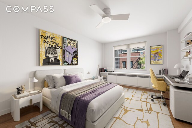 221 E 50th St Unit 6D/7D, New York City, NY 10022 - bedroom with light wood-style floors, a desk, and ceiling fan