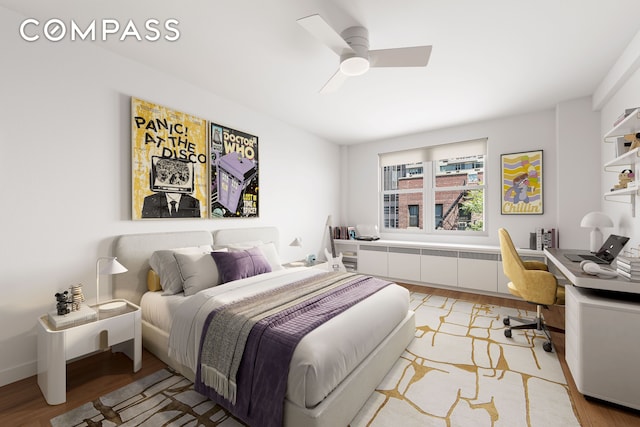 221 E 50th St Unit 6D/7D, New York City, NY 10022 - bedroom with light wood-type flooring, an office area, and a ceiling fan