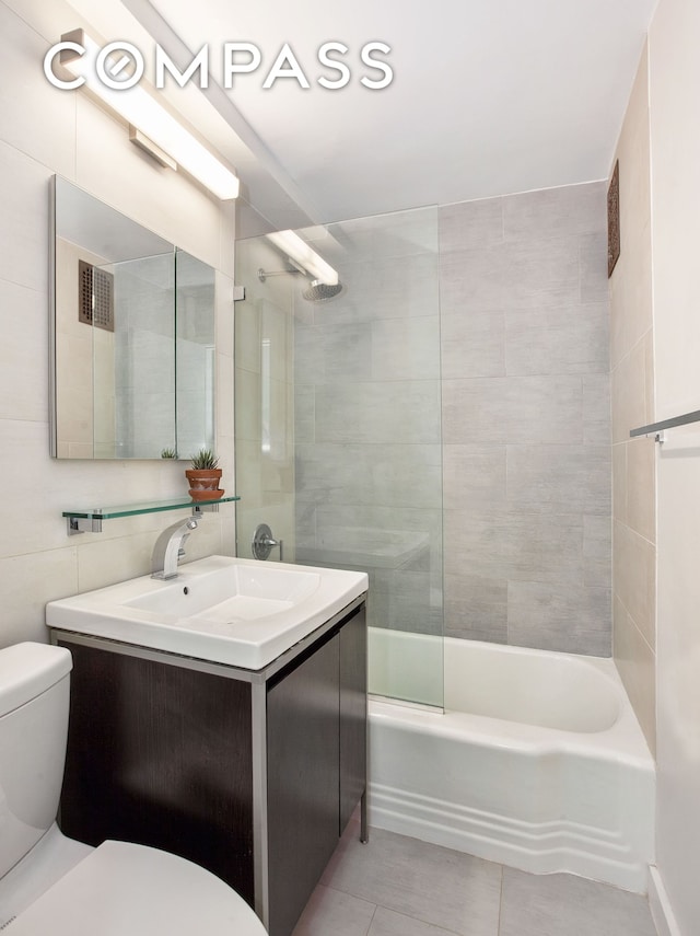 full bathroom featuring toilet, shower / bathing tub combination, tile patterned flooring, and vanity