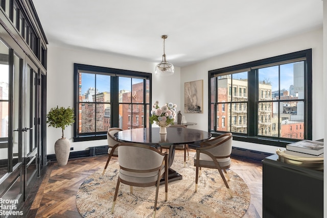 211 Elizabeth St Unit 5N, New York City, NY 10012 - dining area featuring baseboards
