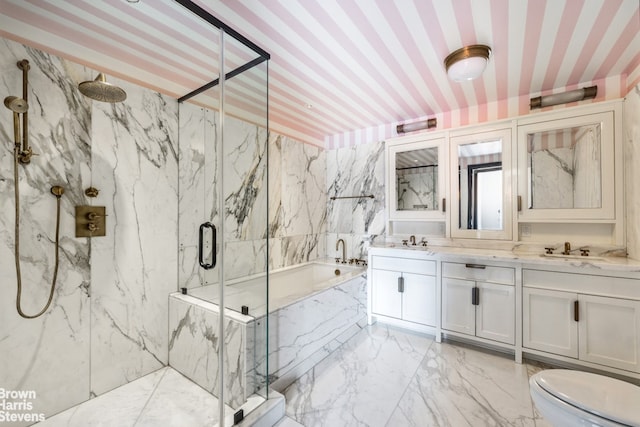 211 Elizabeth St Unit 5N, New York City, NY 10012 - bathroom with a marble finish shower, marble tiled flooring, a garden tub, double vanity, and toilet