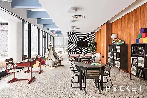 184 Kent Ave Unit C-614, New York City, NY 11249 - dining area with carpet floors and wood walls