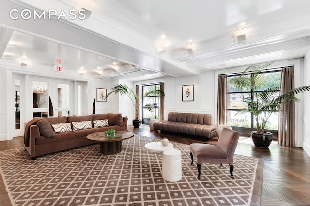 lobby with crown molding and a decorative wall