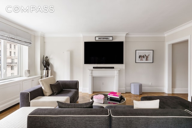 living room featuring ornamental molding and wood finished floors