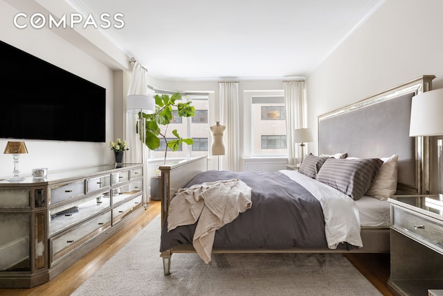 bedroom with wood finished floors