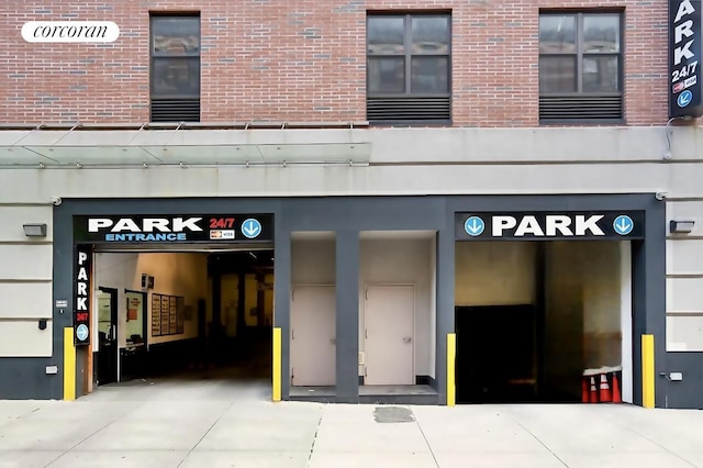 property entrance featuring brick siding