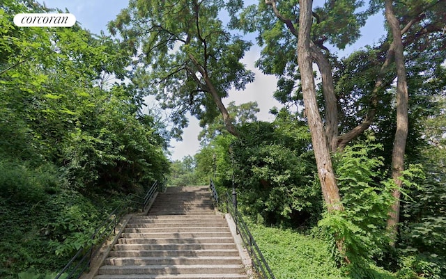 view of community featuring stairway