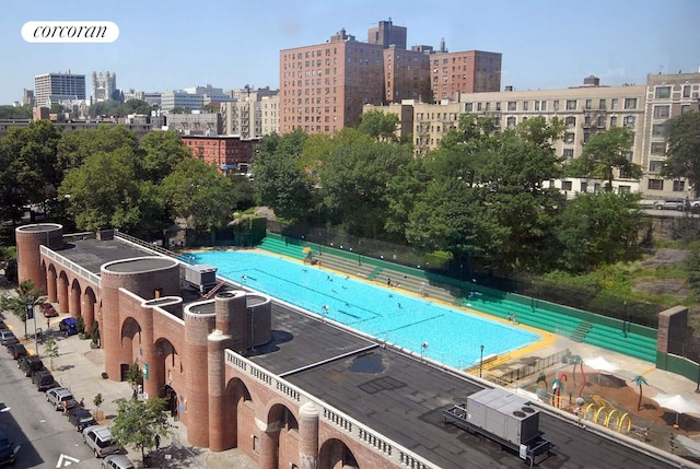 view of urban area featuring a pool
