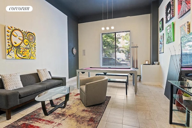 living room with baseboards and light tile patterned flooring