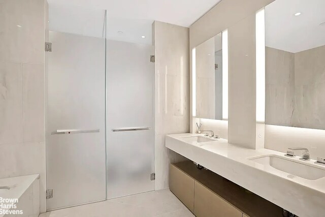 15 Hudson Yards Unit 63A, New York City, NY 10001 - full bathroom featuring a shower stall and double vanity