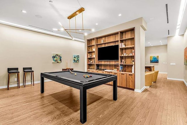 recreation room featuring light wood-type flooring, billiards, baseboards, and built in features
