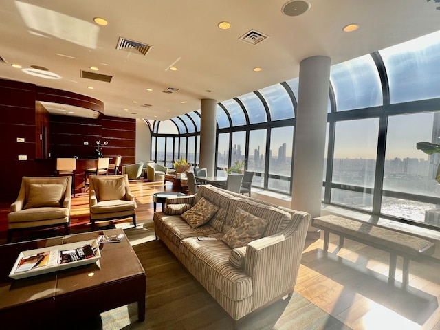 530 E 76th St Unit Ph35H36H, New York City, NY 10021 - workout area featuring visible vents, a view of city, carpet flooring, and a healthy amount of sunlight