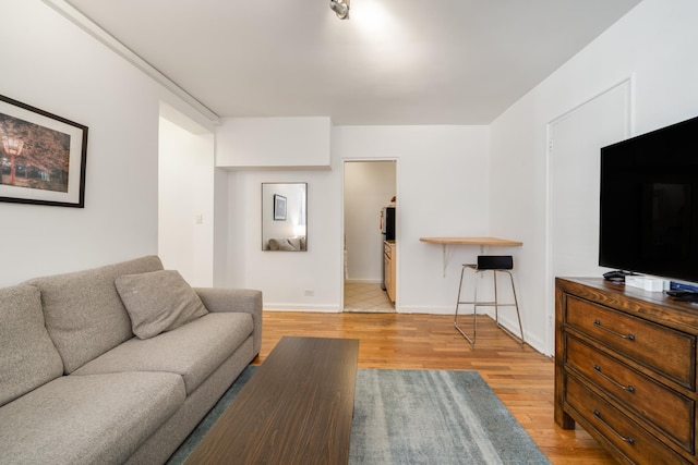 54 E 8th St Unit 6-L, New York City, NY 10003 - living area featuring light wood finished floors and baseboards