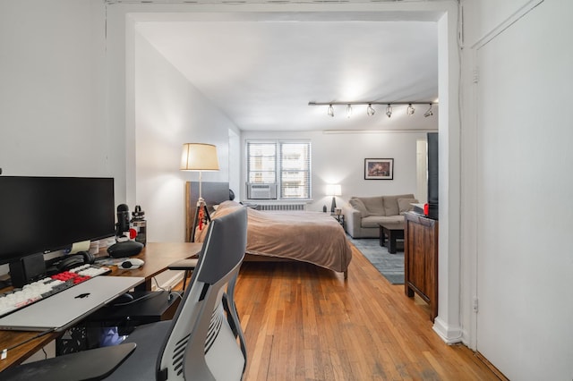 54 E 8th St Unit 6-L, New York City, NY 10003 - bedroom with light wood-style floors and cooling unit