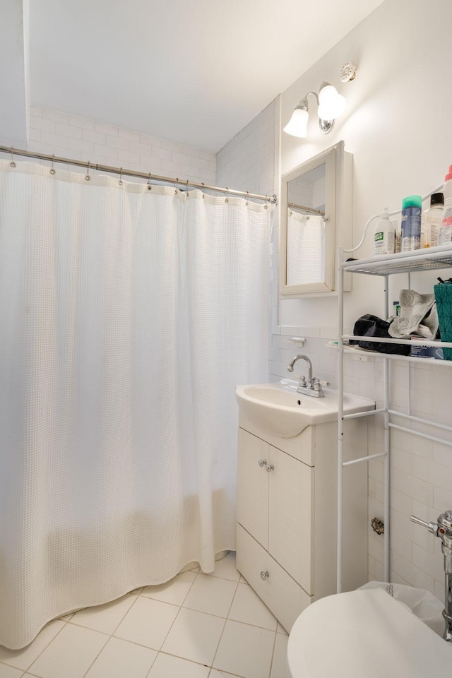 54 E 8th St Unit 6-L, New York City, NY 10003 - bathroom with vanity and tile patterned floors